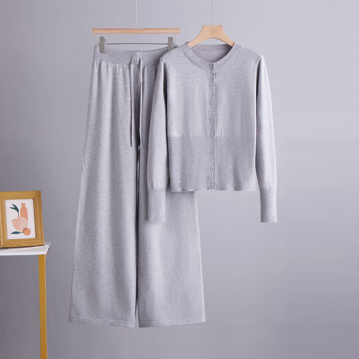 Conjunto de dos piezas con cárdigan de cuello redondo y botones y pantalón ancho recto de tiro alto