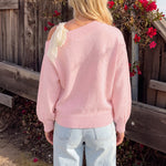 Shoulder tied bow long sleeved women's sweater