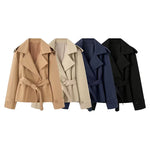Double breasted jacket with waistband and suit collar