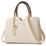 Bolso de mano y bandolera para mujer con bordado y asa superior